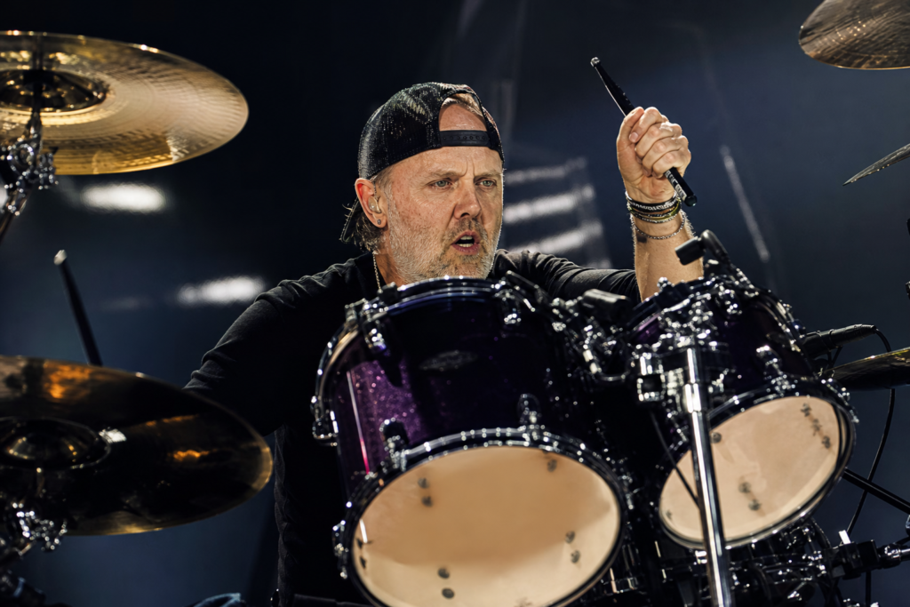 Lars Ulrich performs on drums during a Metallica concert.
