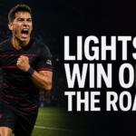 Las Vegas Lights FC player celebrating a road victory in a professional soccer stadium