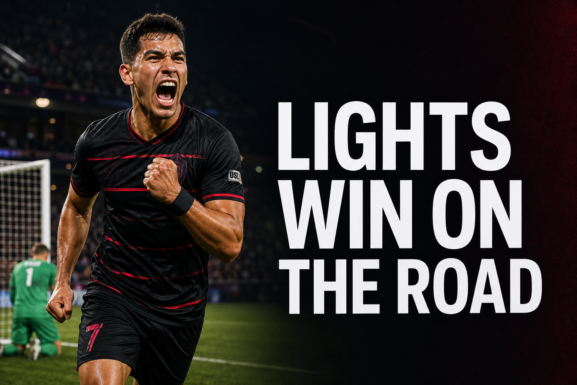 Las Vegas Lights FC player celebrating a road victory in a professional soccer stadium