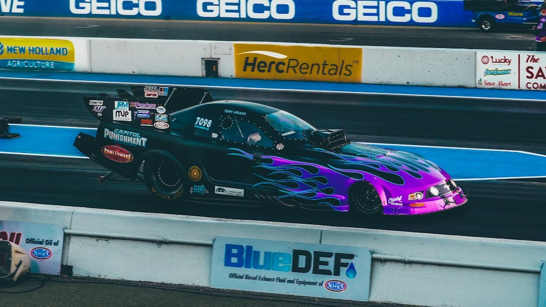 Drag racing car accelerating on a track; illustrative photograph, not the 2026 Las Vegas Nationals