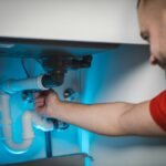 Plumbing repair in progress at a home