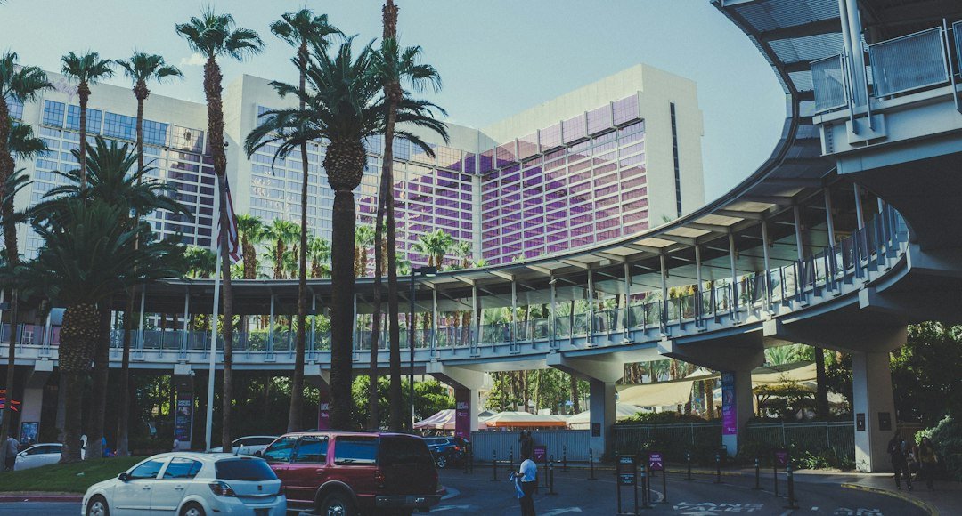 Red-and-white Las Vegas Monorail trains by the station