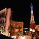 Las Vegas Strip resort hotel buildings and Eiffel Tower replica illuminated at night
