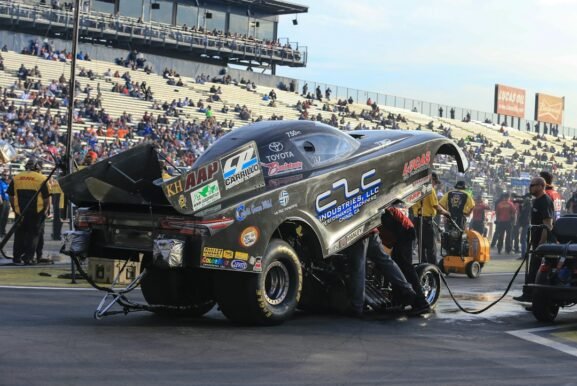Drag racing competitors preparing at an NHRA event in Pomona, California; illustrative photo, not the 2026 Las Vegas Nationals