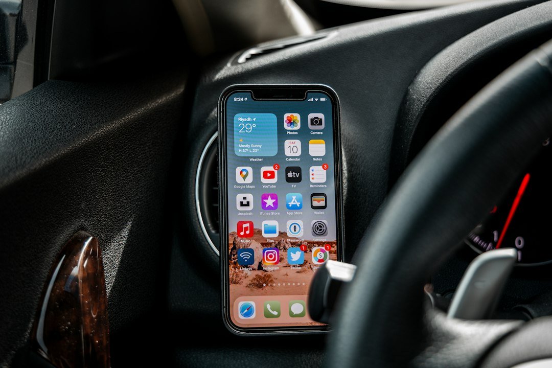 Phone mounted in vehicle illustrating how to request remote help